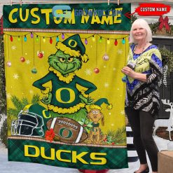 Alternative view of NCAA Oregon Ducks Custom Name Grinch Christmas Fleece Blanket